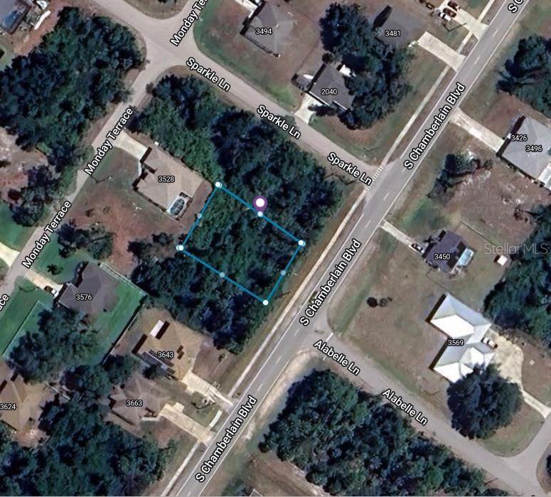 an aerial view of multiple houses and yard