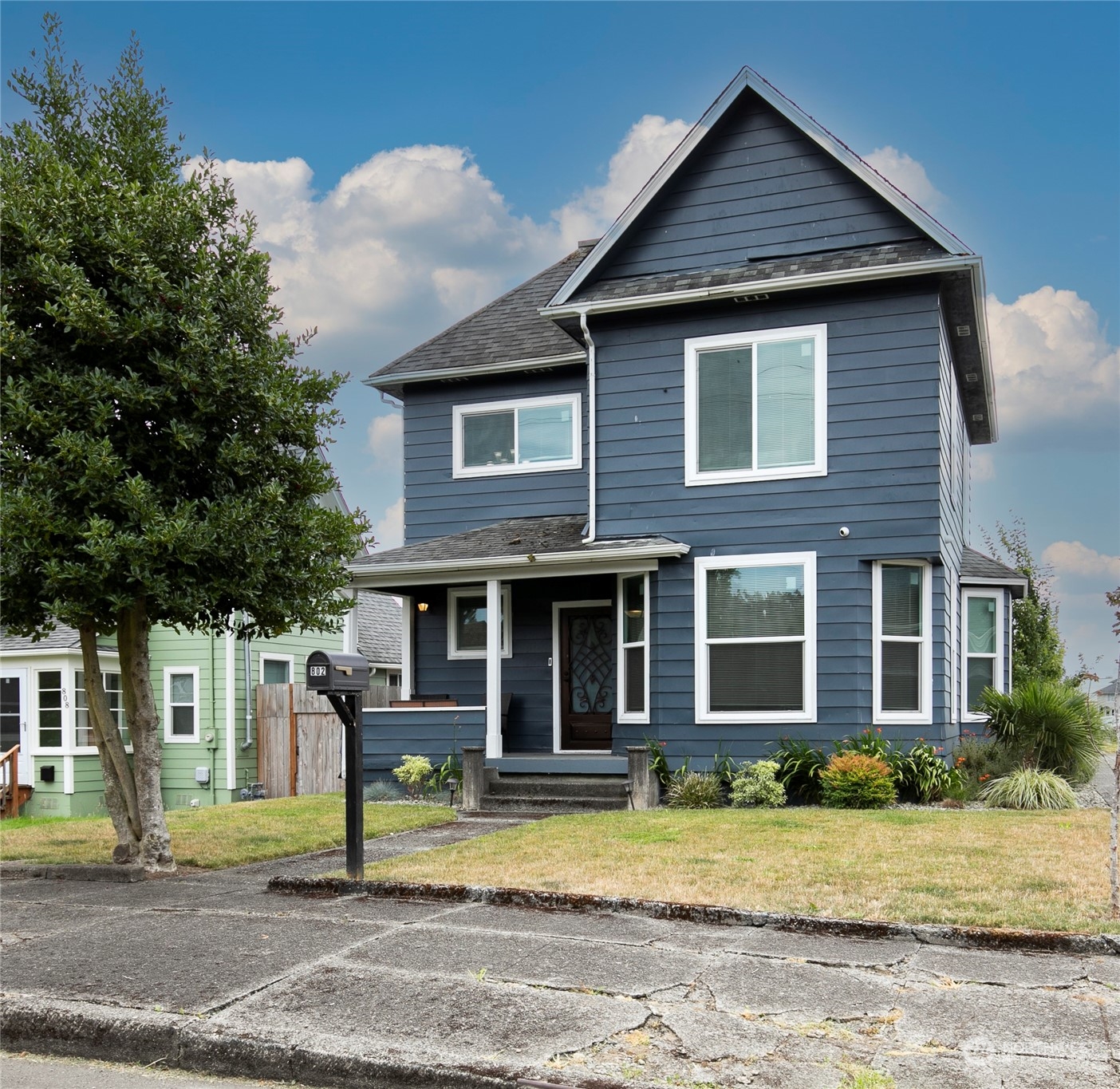 a front view of a house with a yard