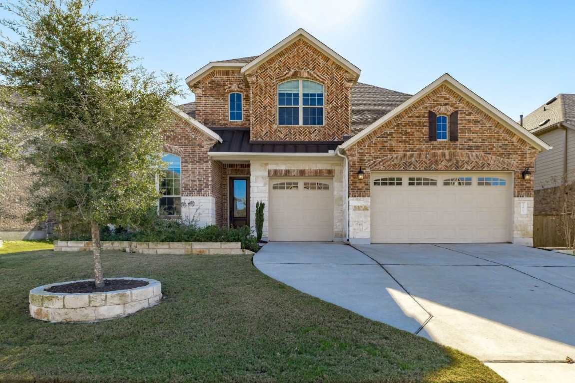 a front view of a house with a yard