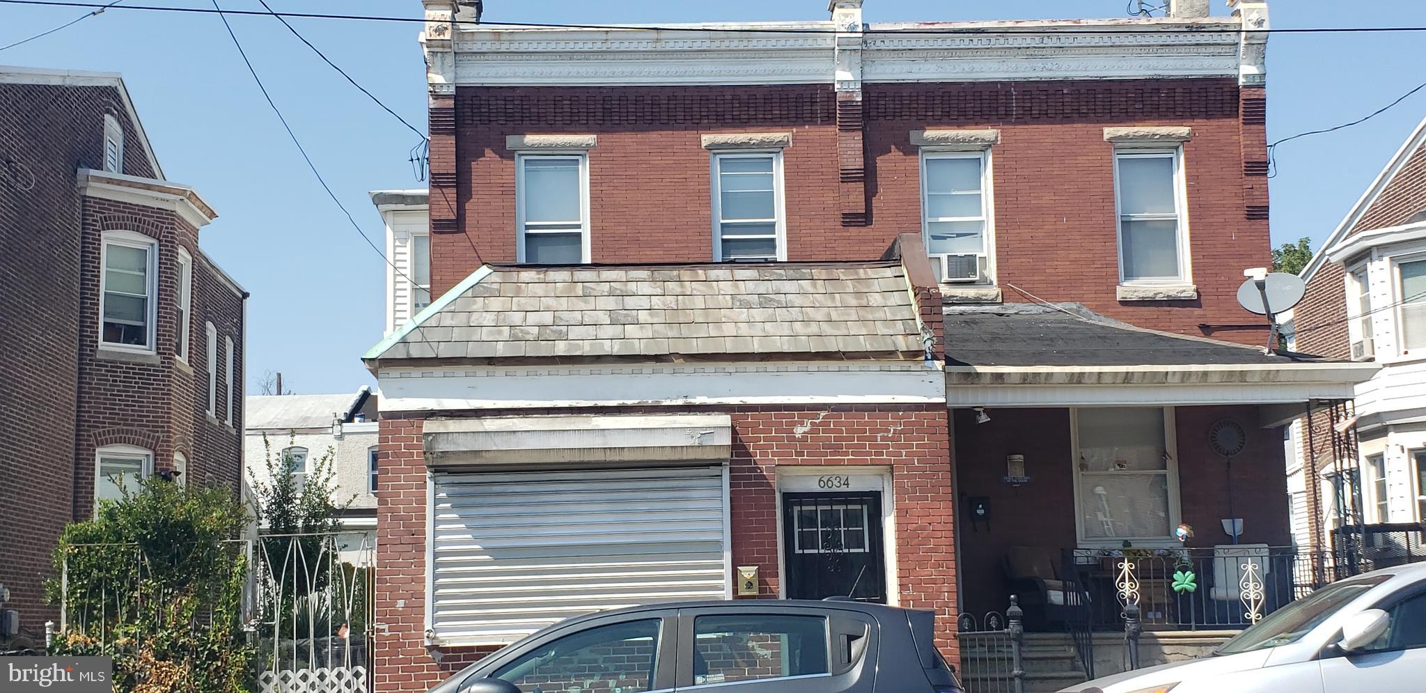 a view of a house with a door and balcony