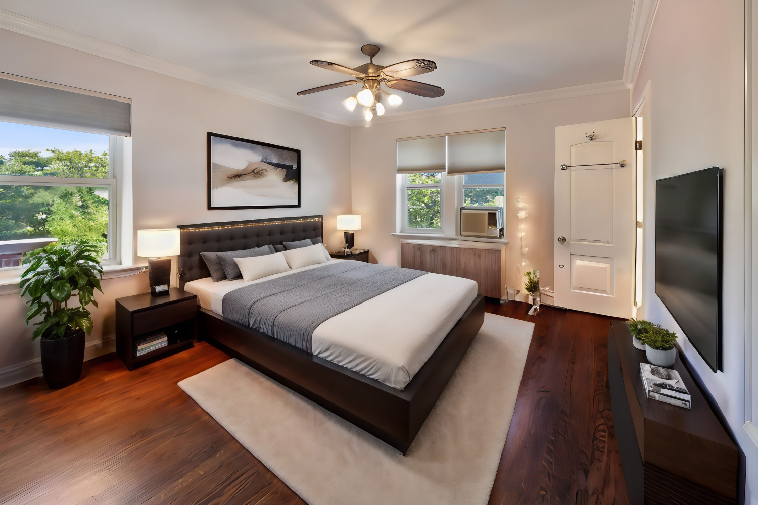 a bedroom with a bed potted plant on table and a window