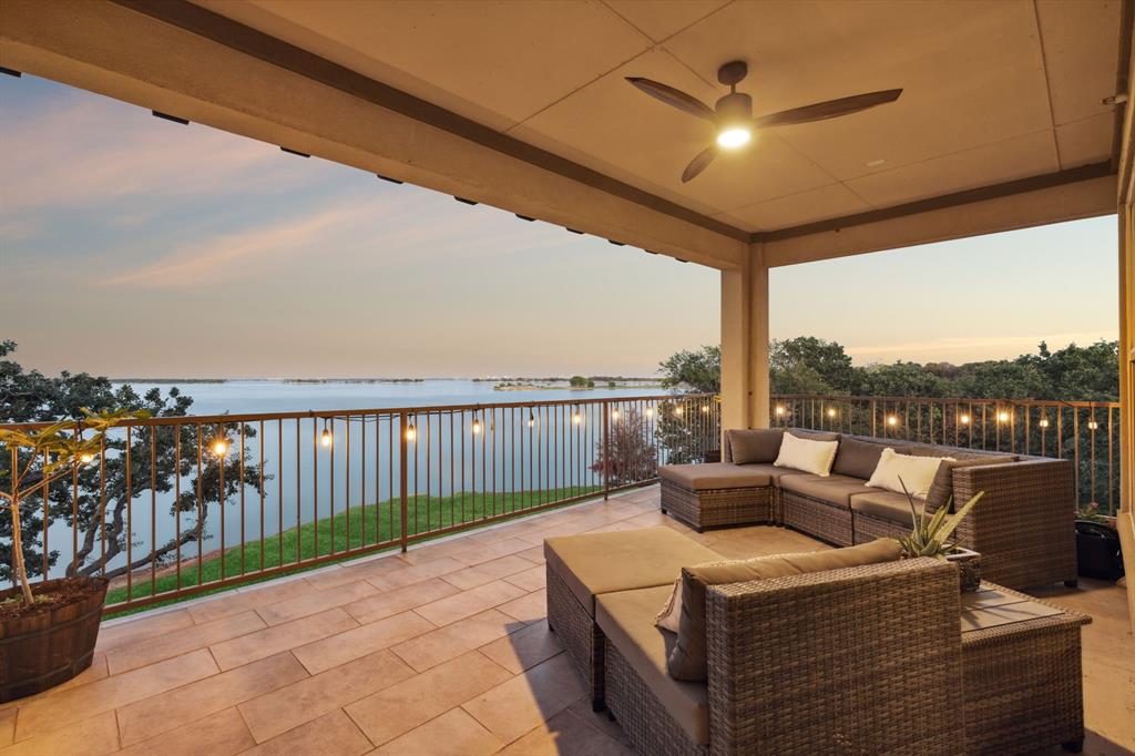 a view of a balcony with furniture