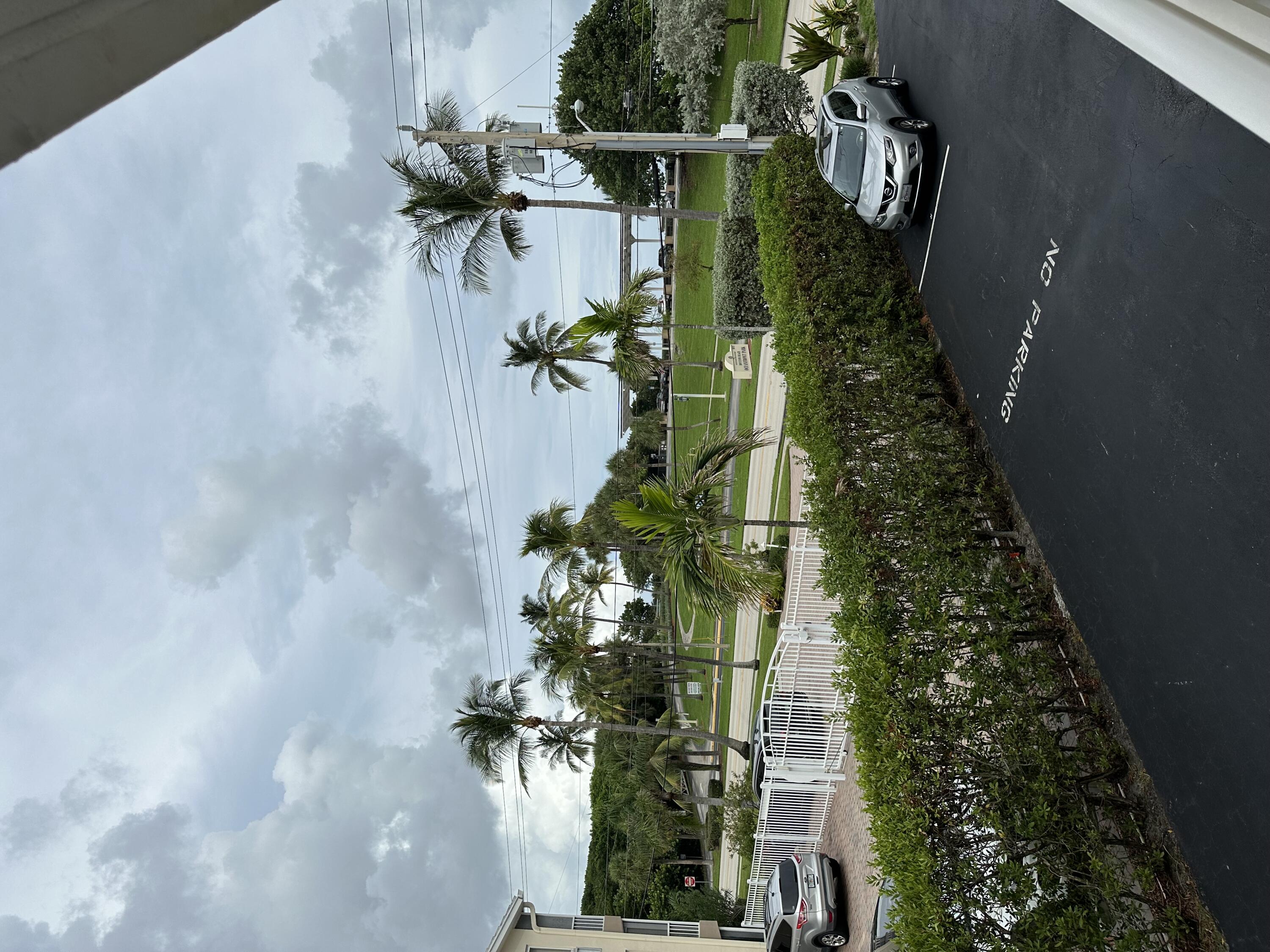 a front view of a house with garden view