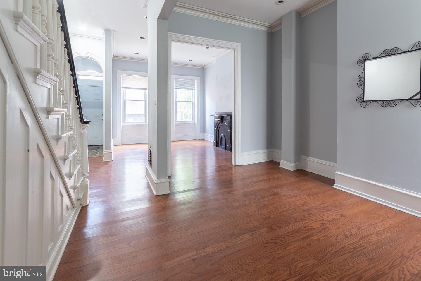 a view of an entryway with wooden floor