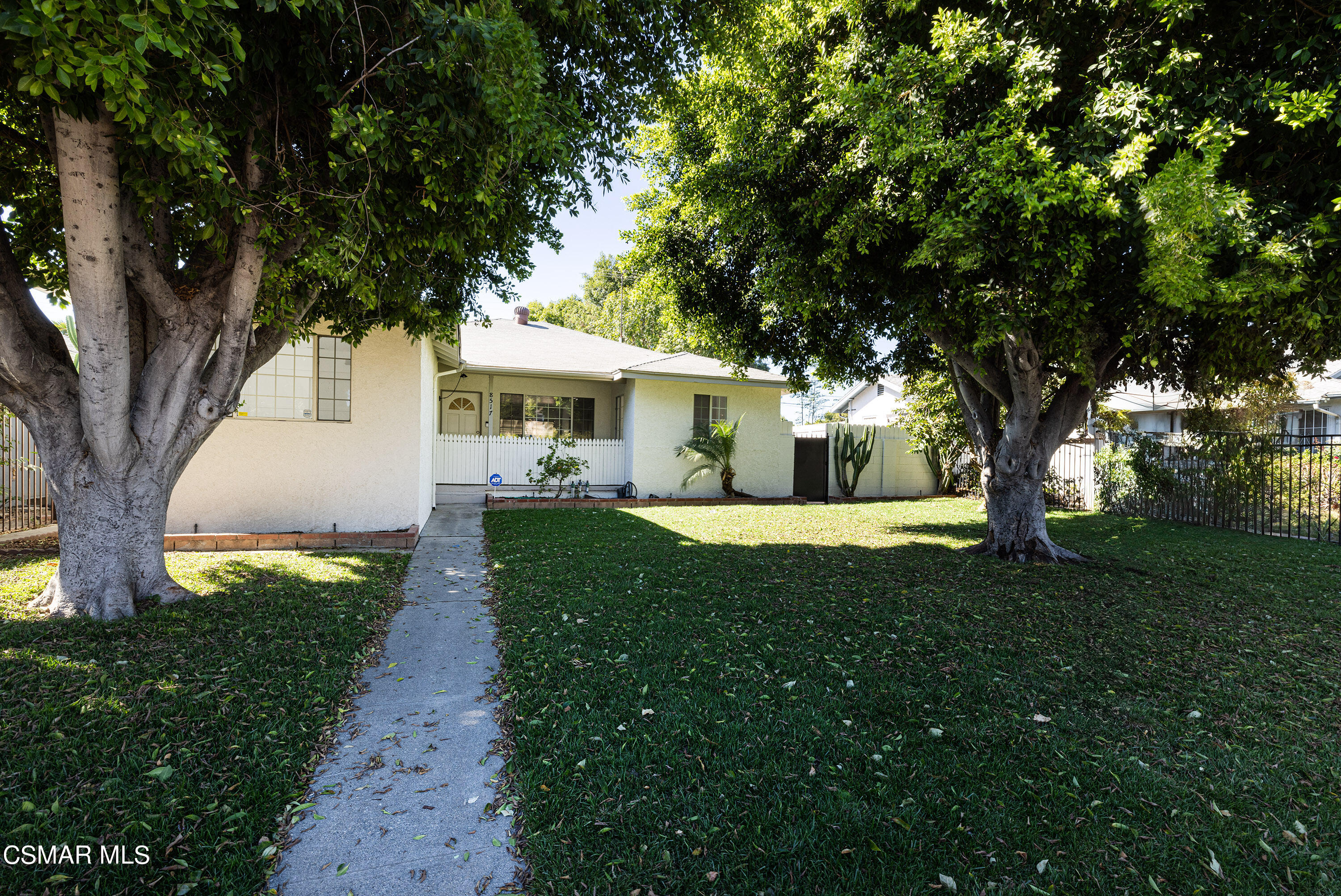 a view of house with yard