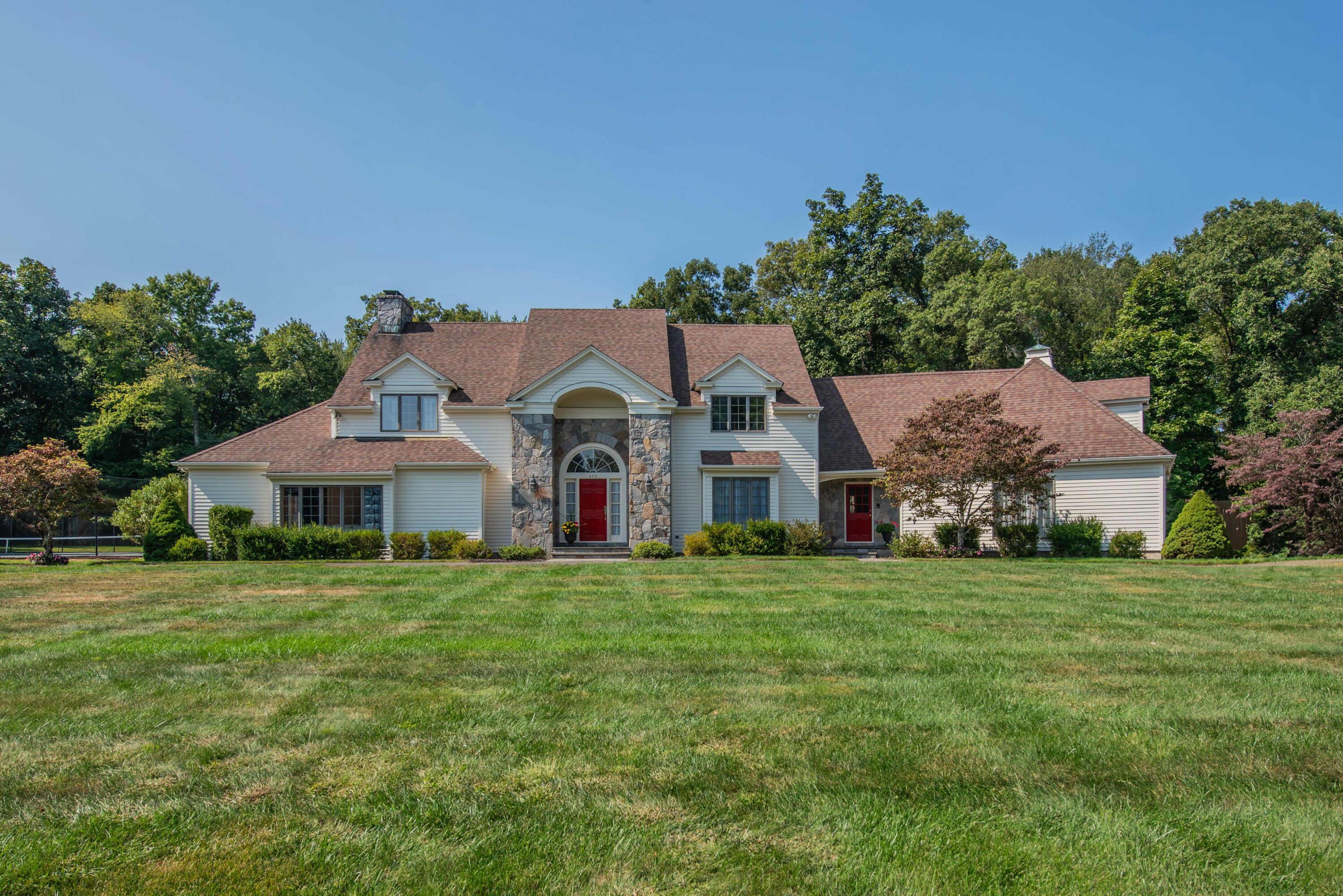 a front view of a house with a yard