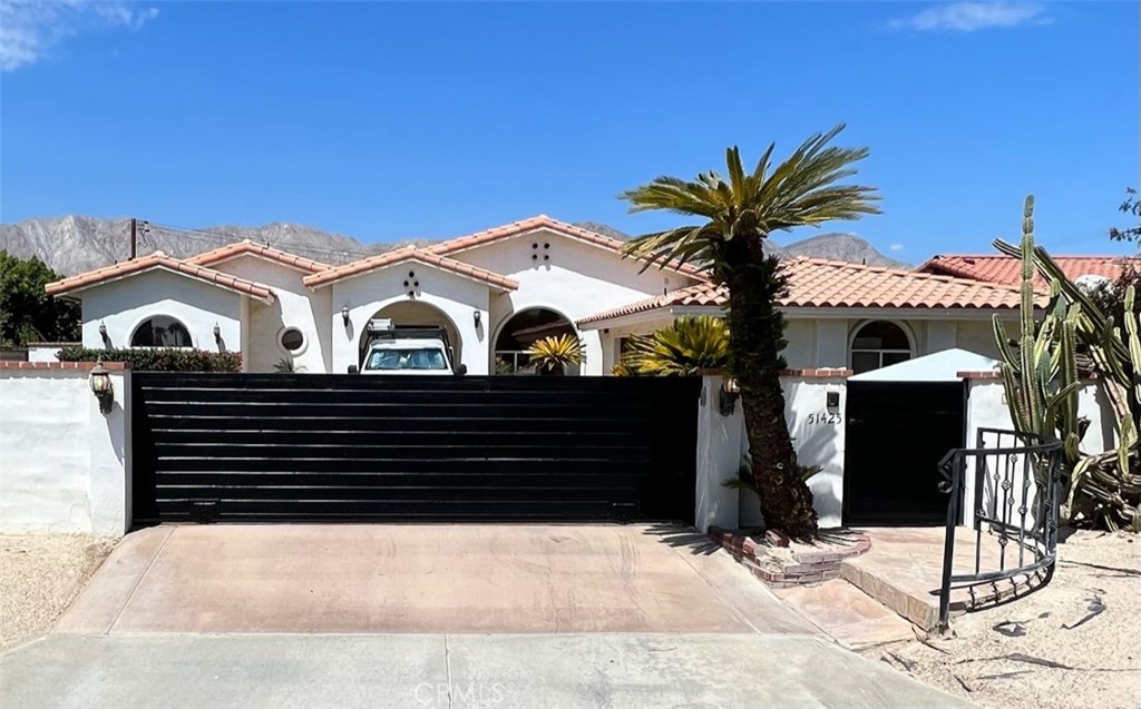 a view of a house with a bench in patio