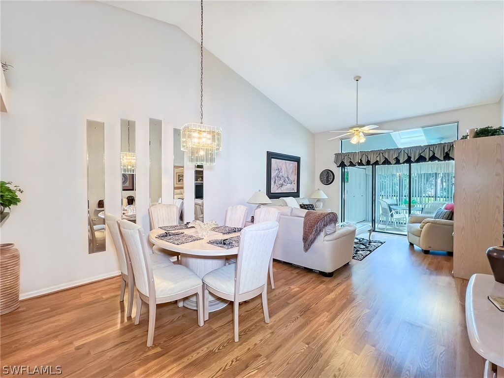 a view of a livingroom with furniture window and wooden floor