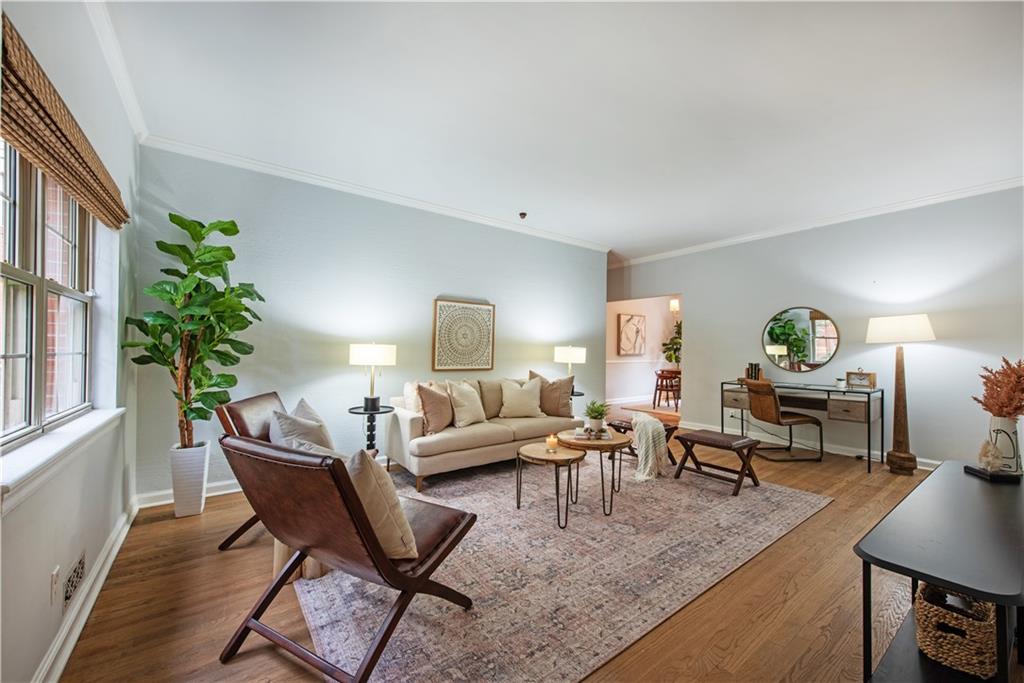 a living room with furniture and a lamp