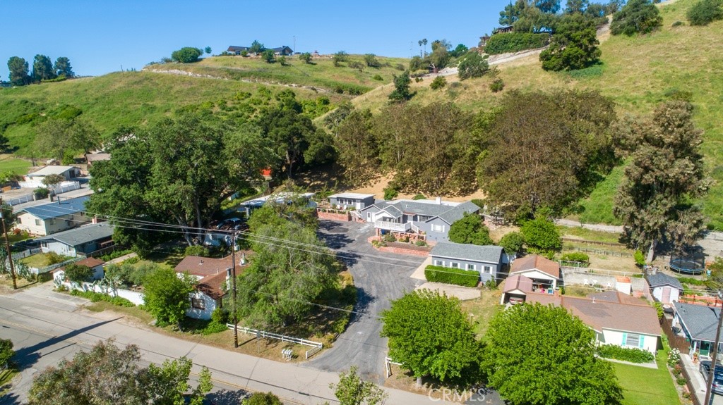 an aerial view of a house with a yard