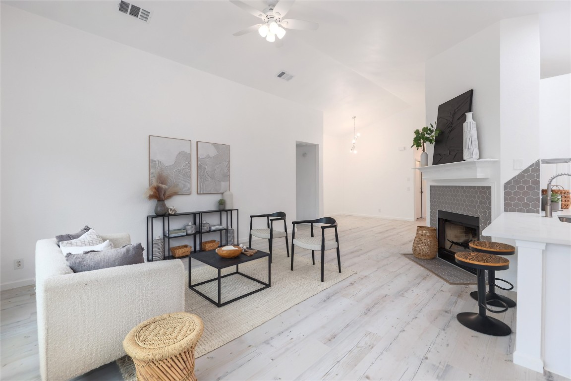 a living room with furniture and a fireplace