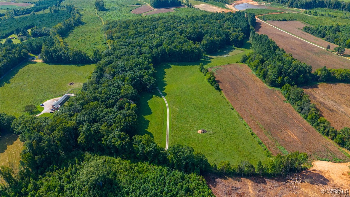 an aerial view of a houses with a yard