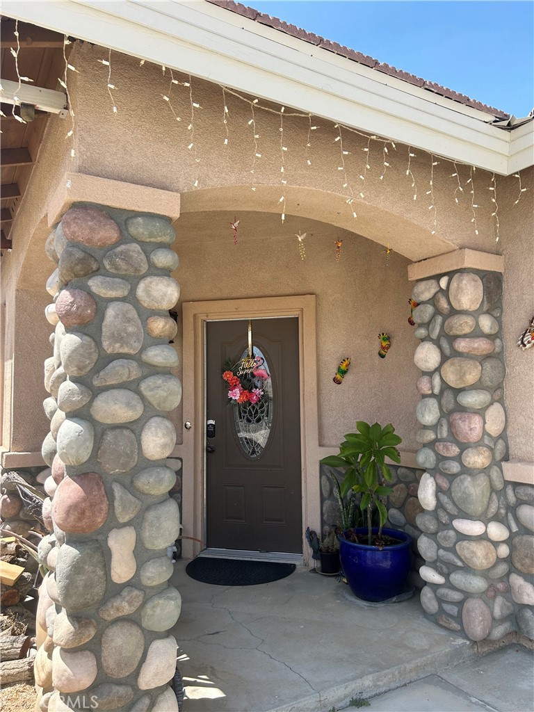 a view of a entryway with flower pots