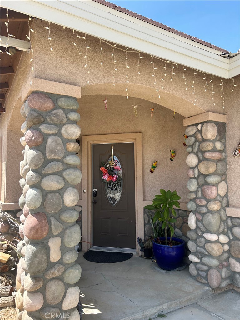 a view of a entryway with flower pots