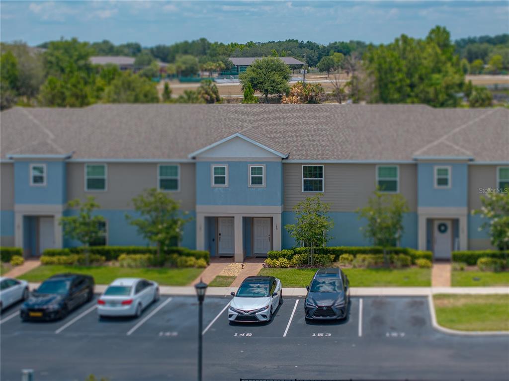 a couple of cars parked in front of a house