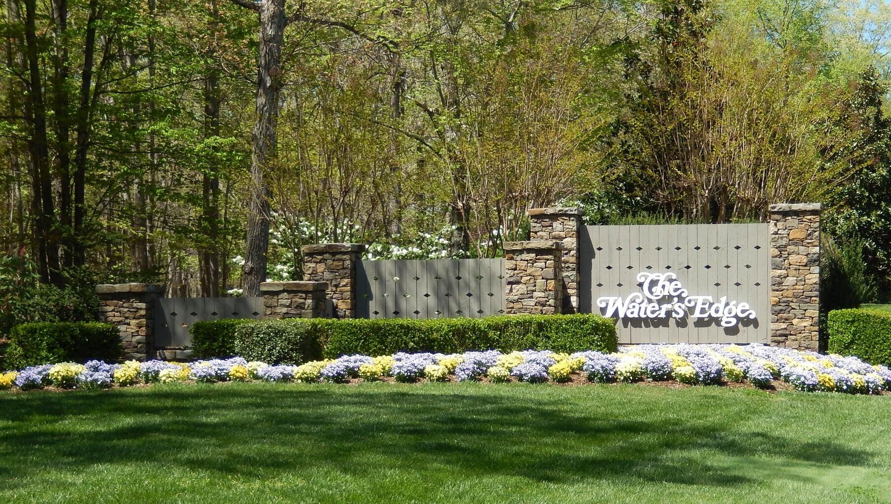 a view of backyard with garden and trees