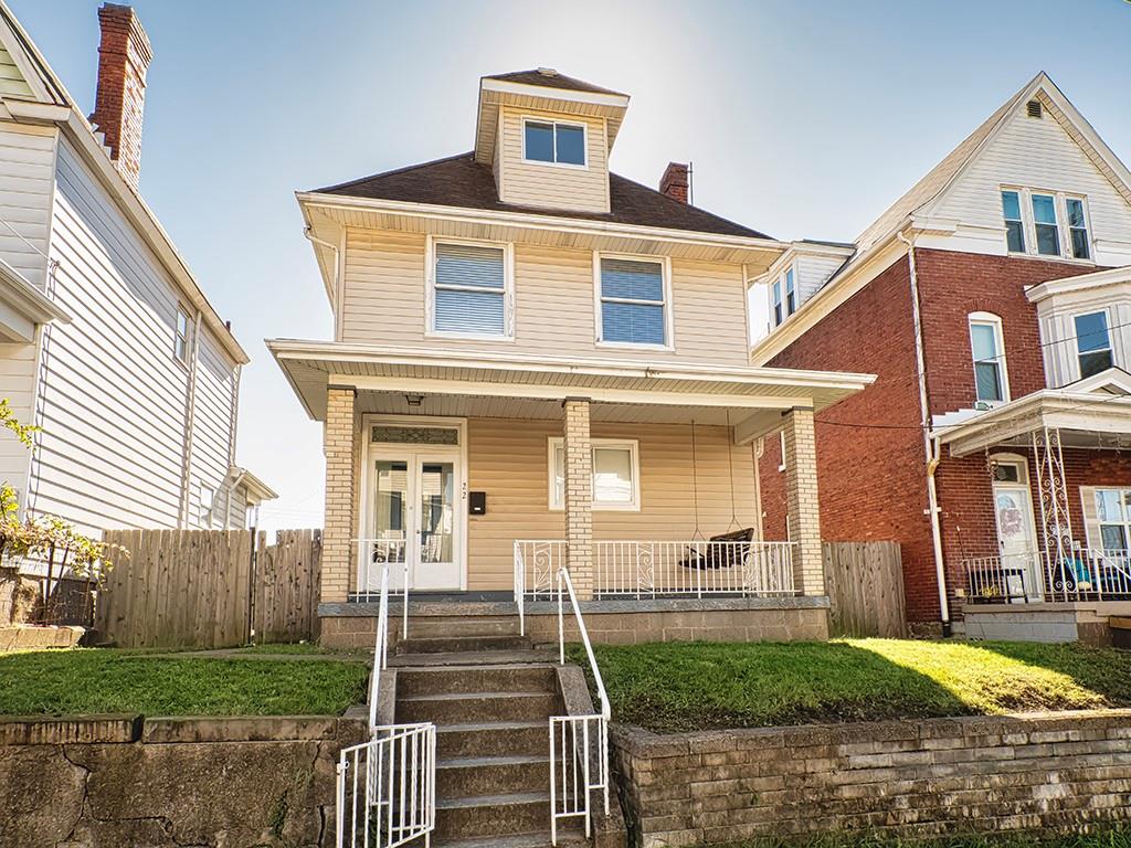 a front view of a house with a yard