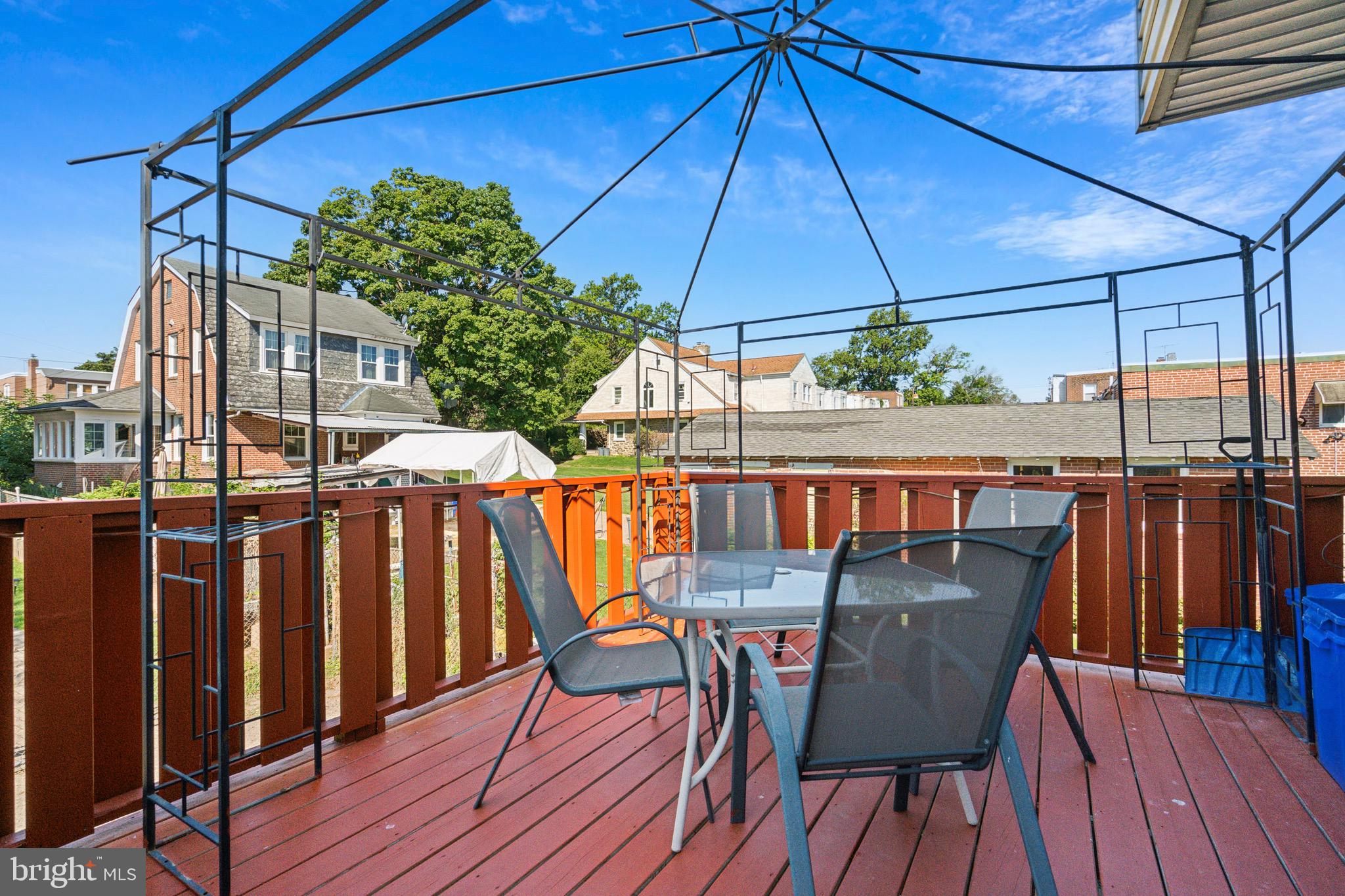 a outdoor view with sitting space and trees