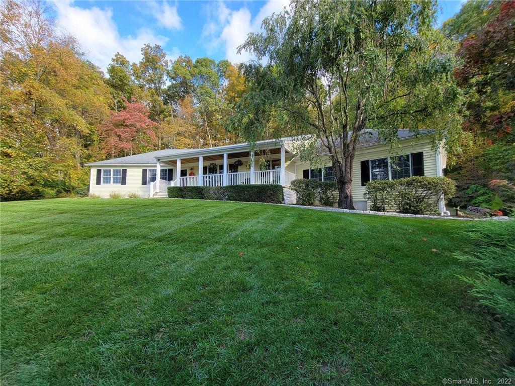 23 Topledge Road, Redding, CT. Enjoy all seasons from this beautifully sited home set on a knoll. Distant views can be had as the season changes from fall to winter.