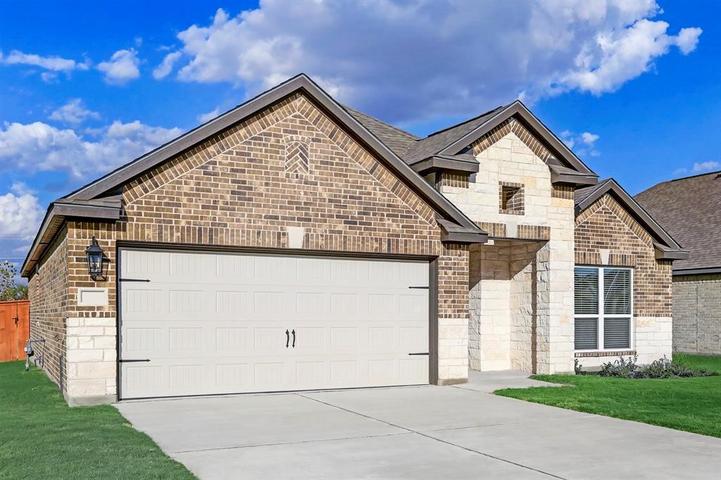 a view of residential house with garage