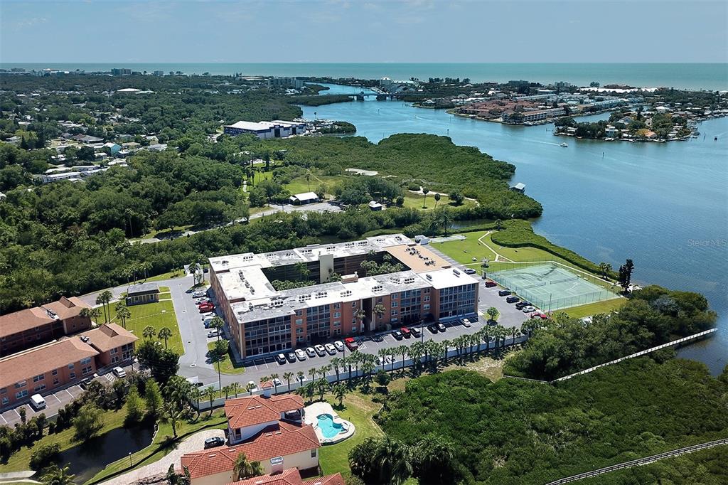 an aerial view of a house with a lake view