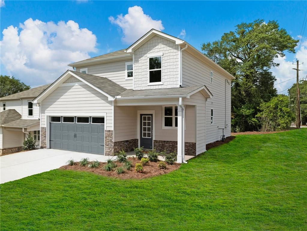 a front view of house with yard and green space