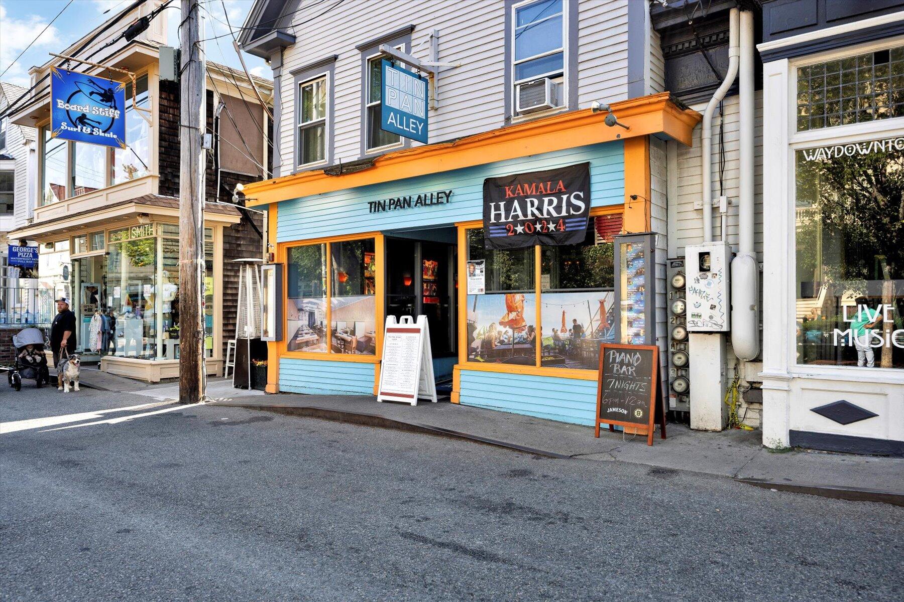 a view of a building with retail shops