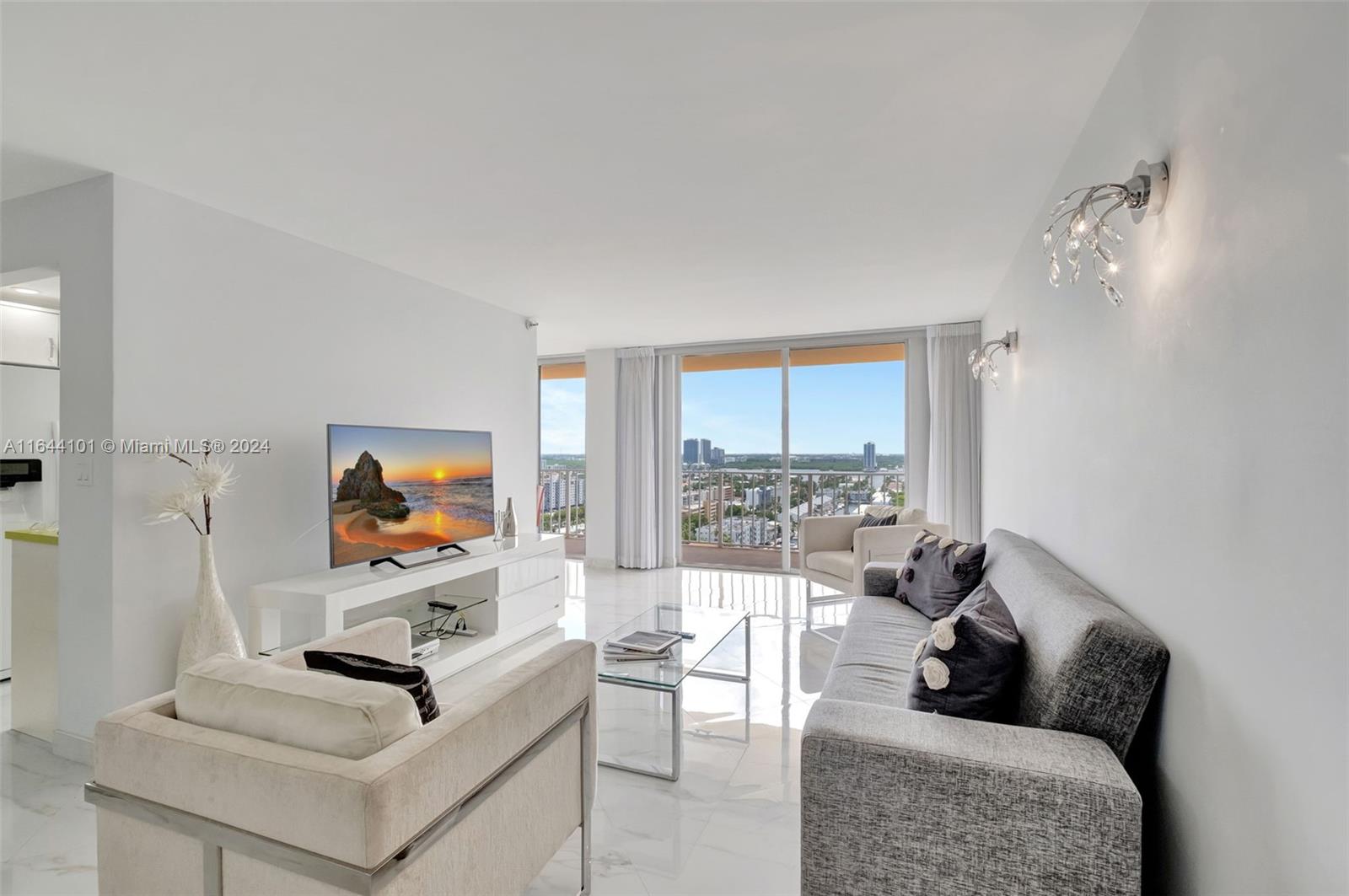 a living room with furniture and a flat screen tv