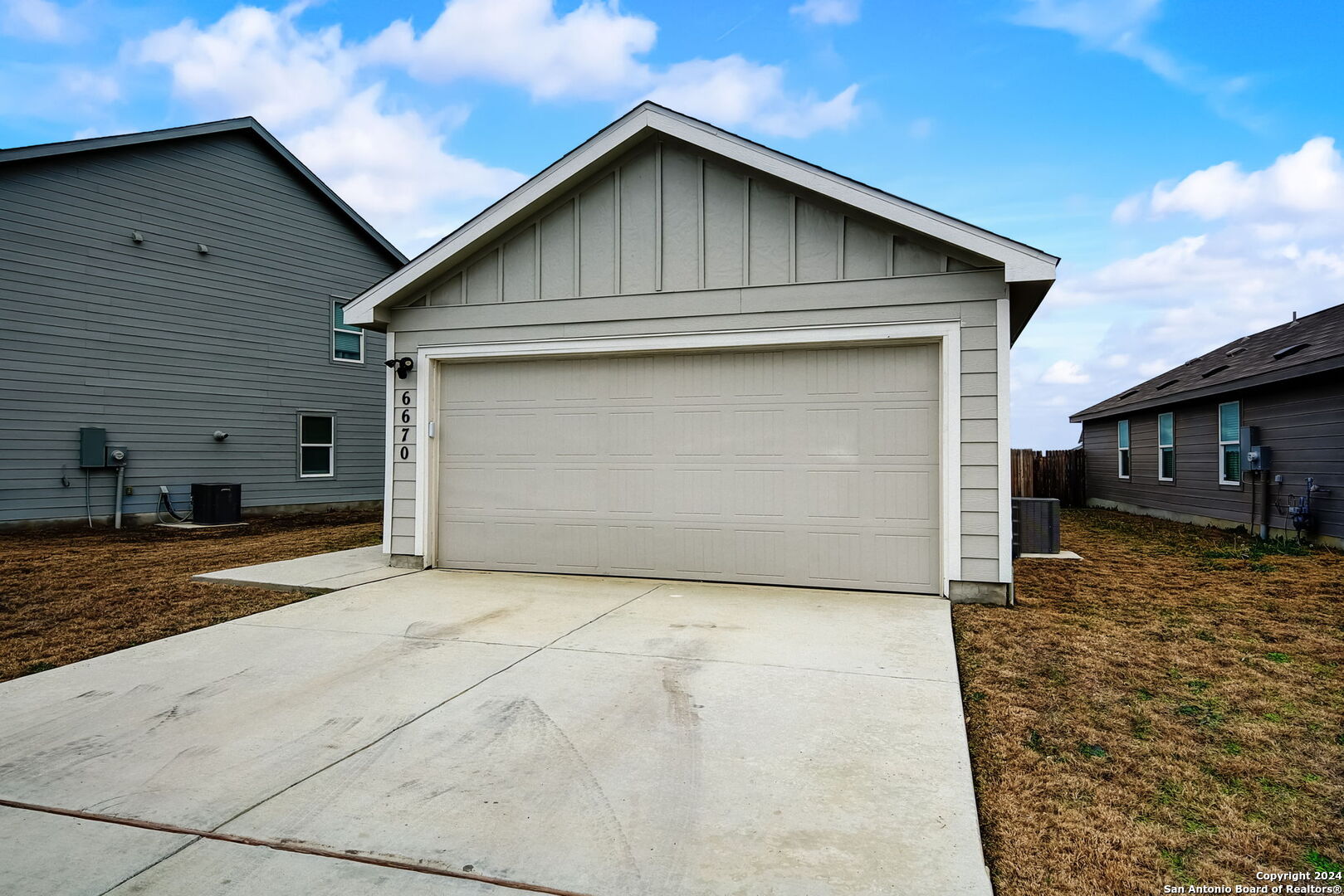 a front view of a house with garage