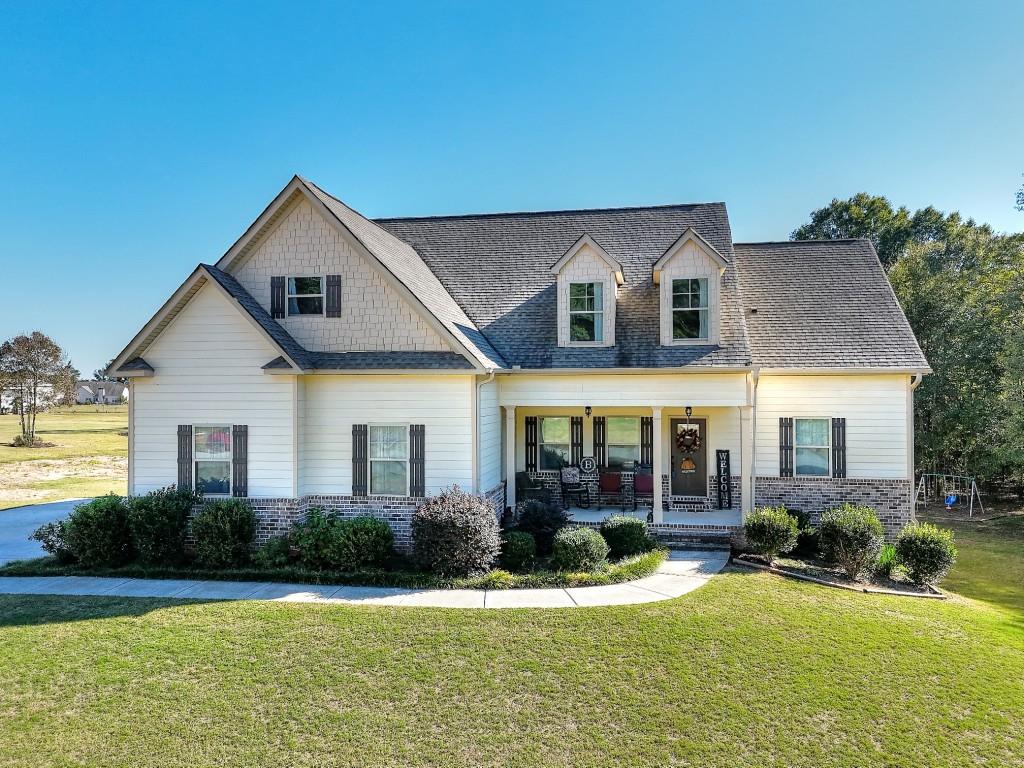 a front view of a house with a yard