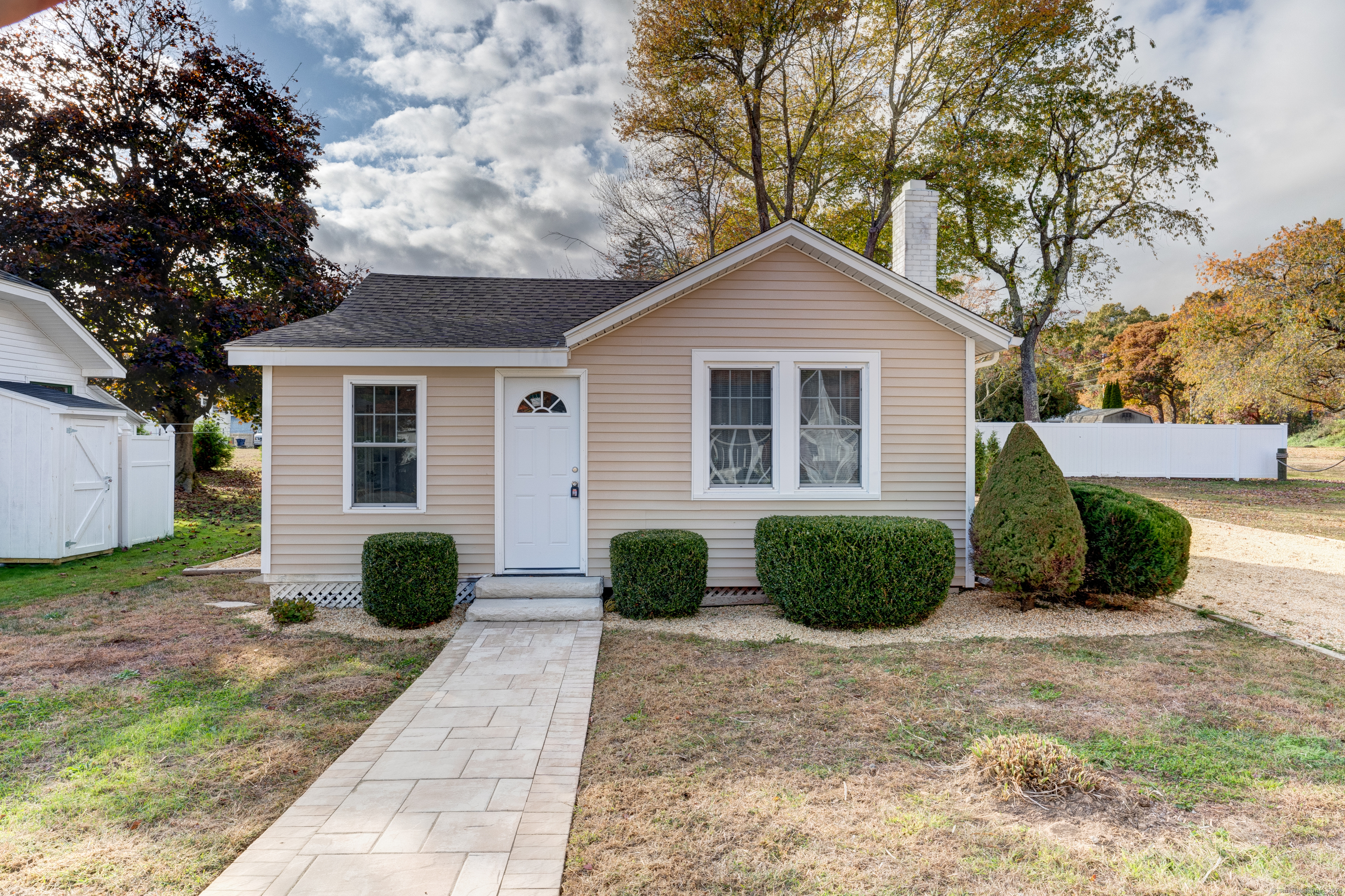 a view of a house with a yard