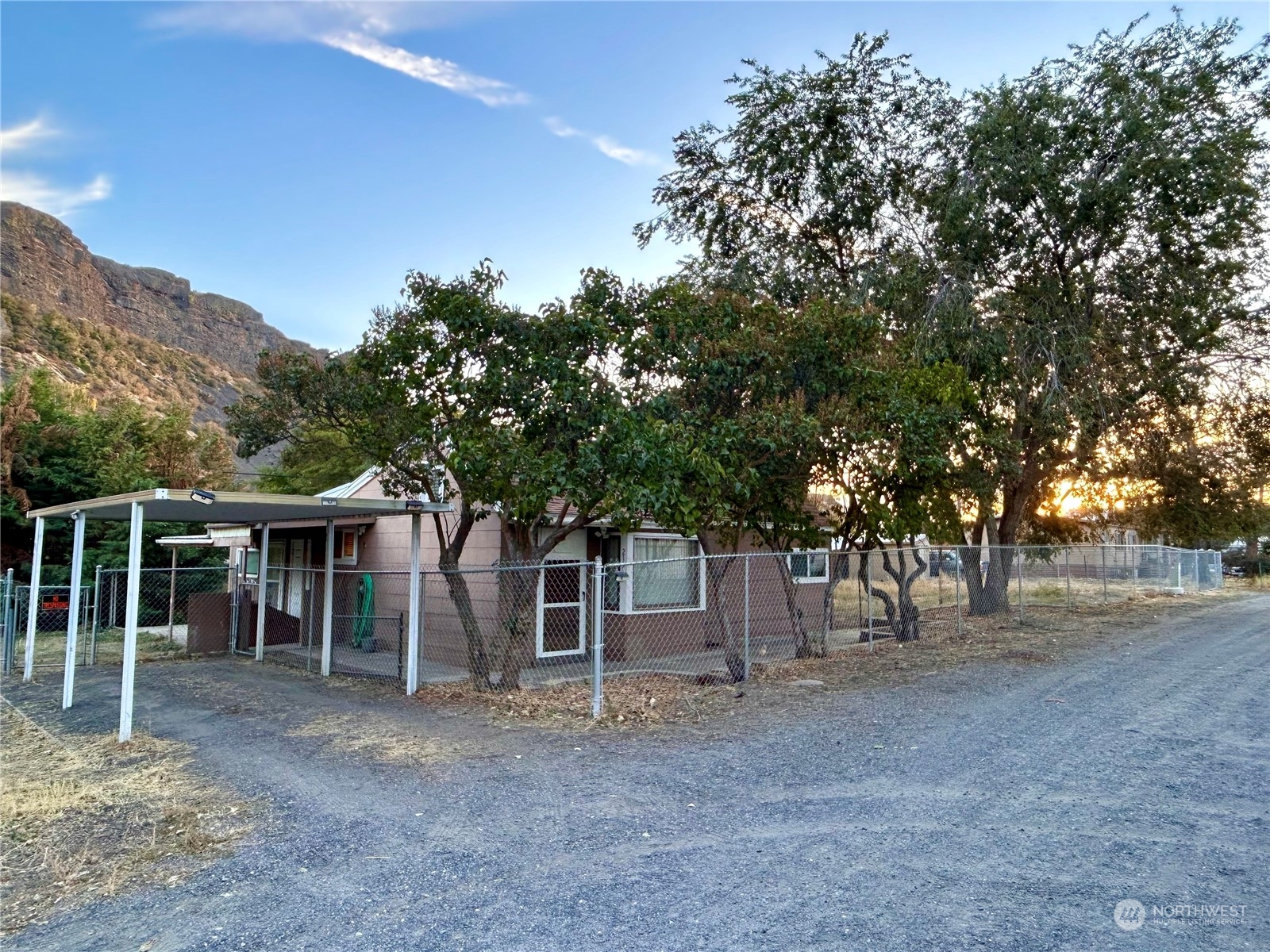 a view of a house with a tree