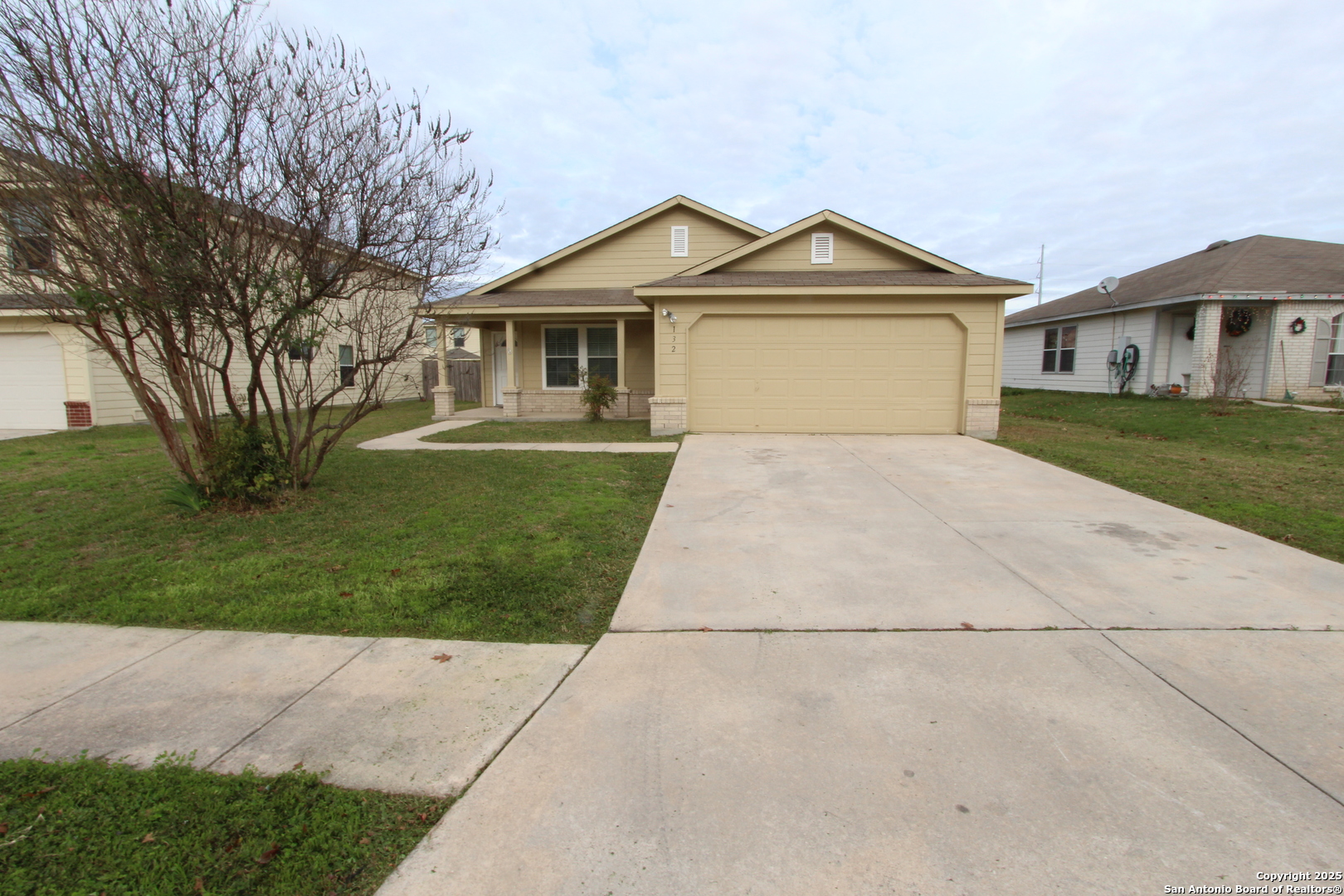 a front view of a house with a yard