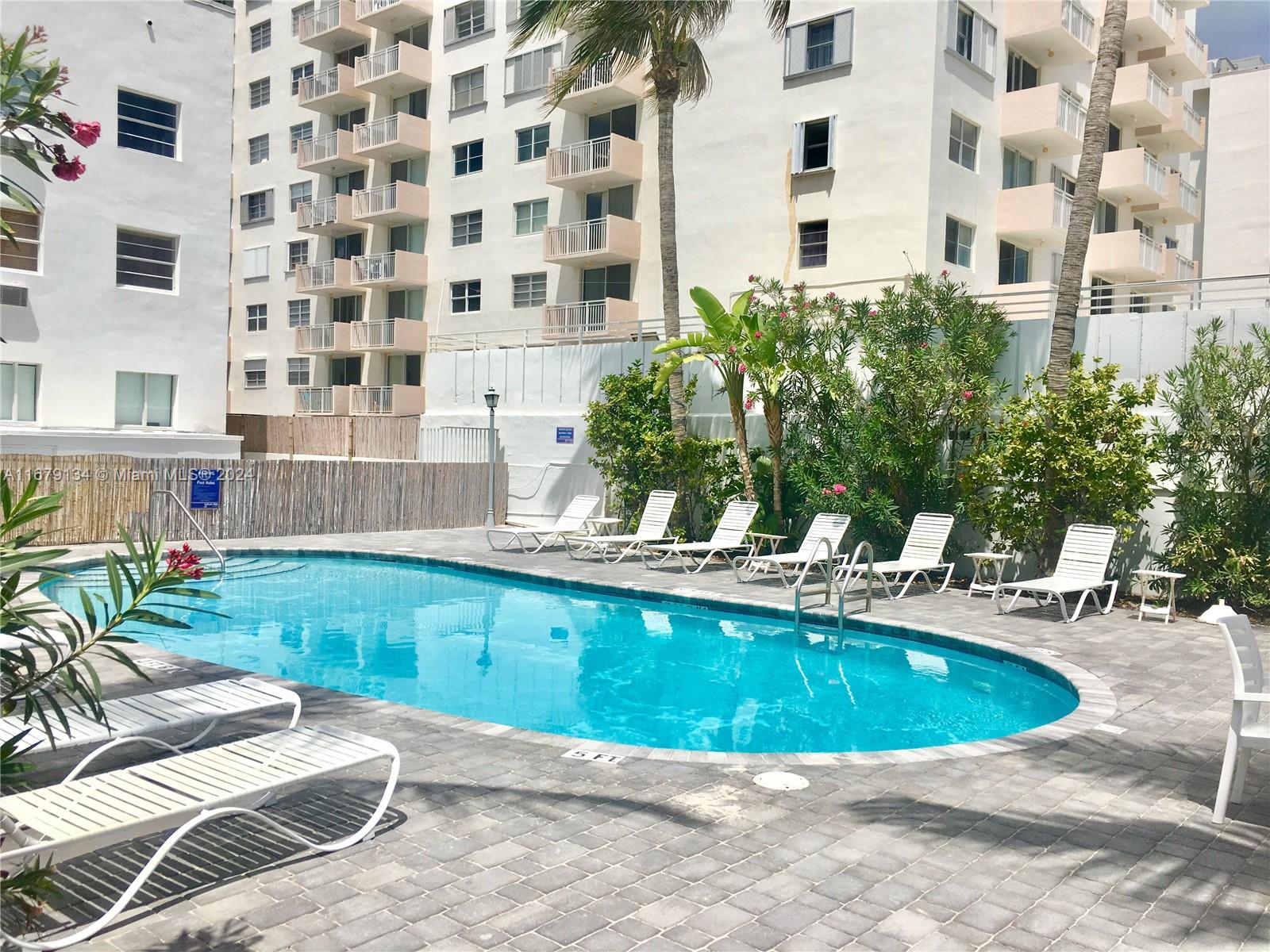 a view of a swimming pool with a patio