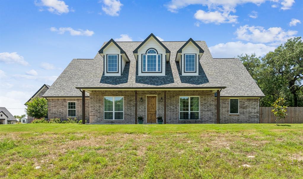 front view of a house with a yard