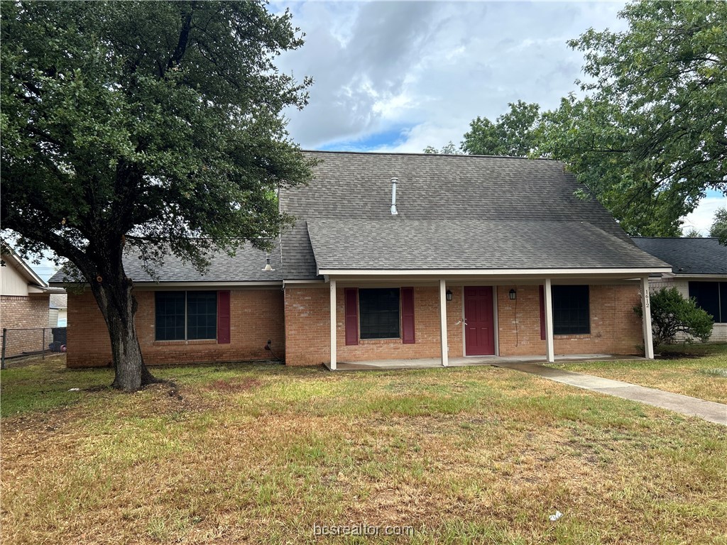 front view of a house with a yard