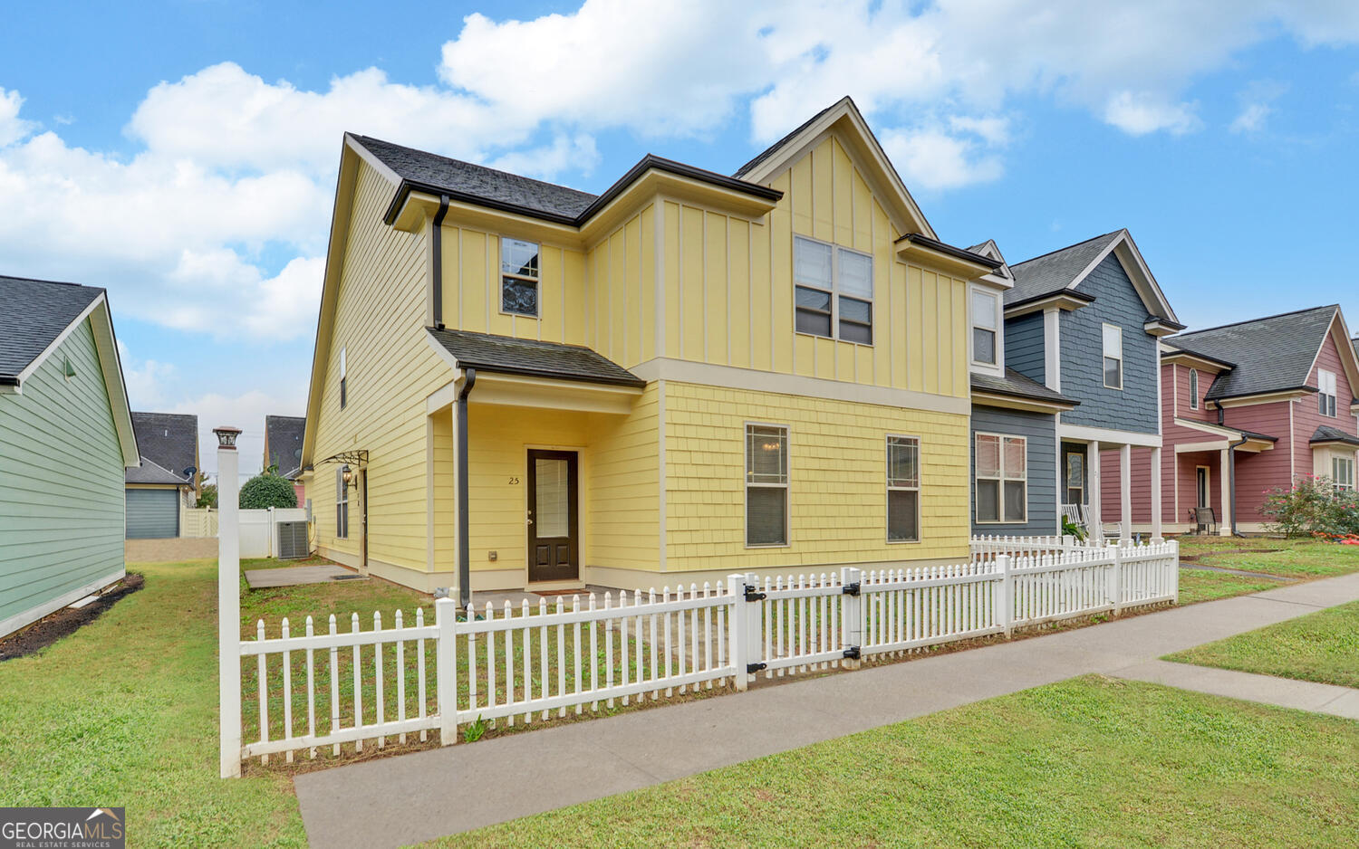 a front view of a house with a yard