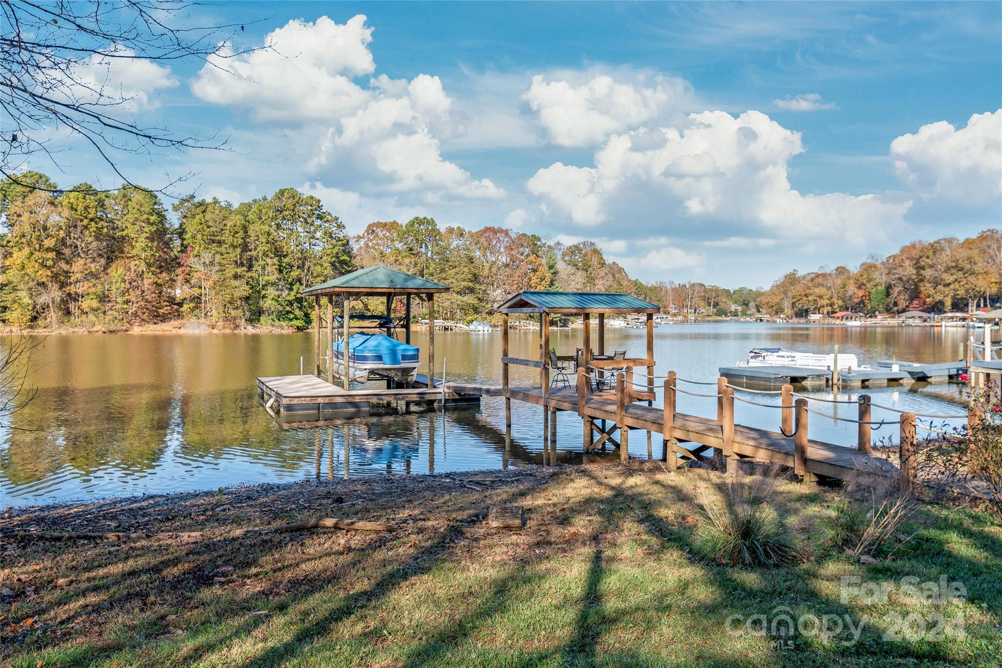 a view of a lake with a sitting area