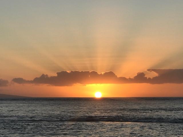 a view of ocean with sunset