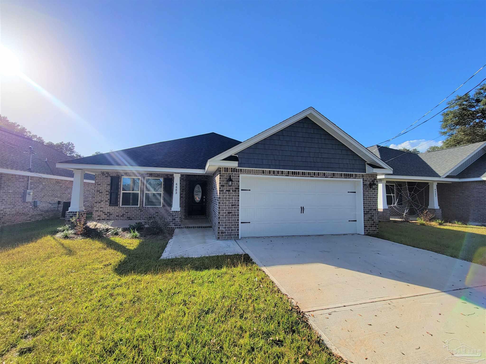 a front view of a house with yard