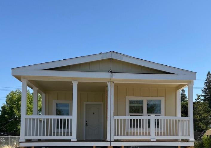 a front view of a house with porch