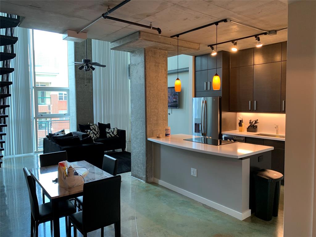 a kitchen with a table and chairs in it