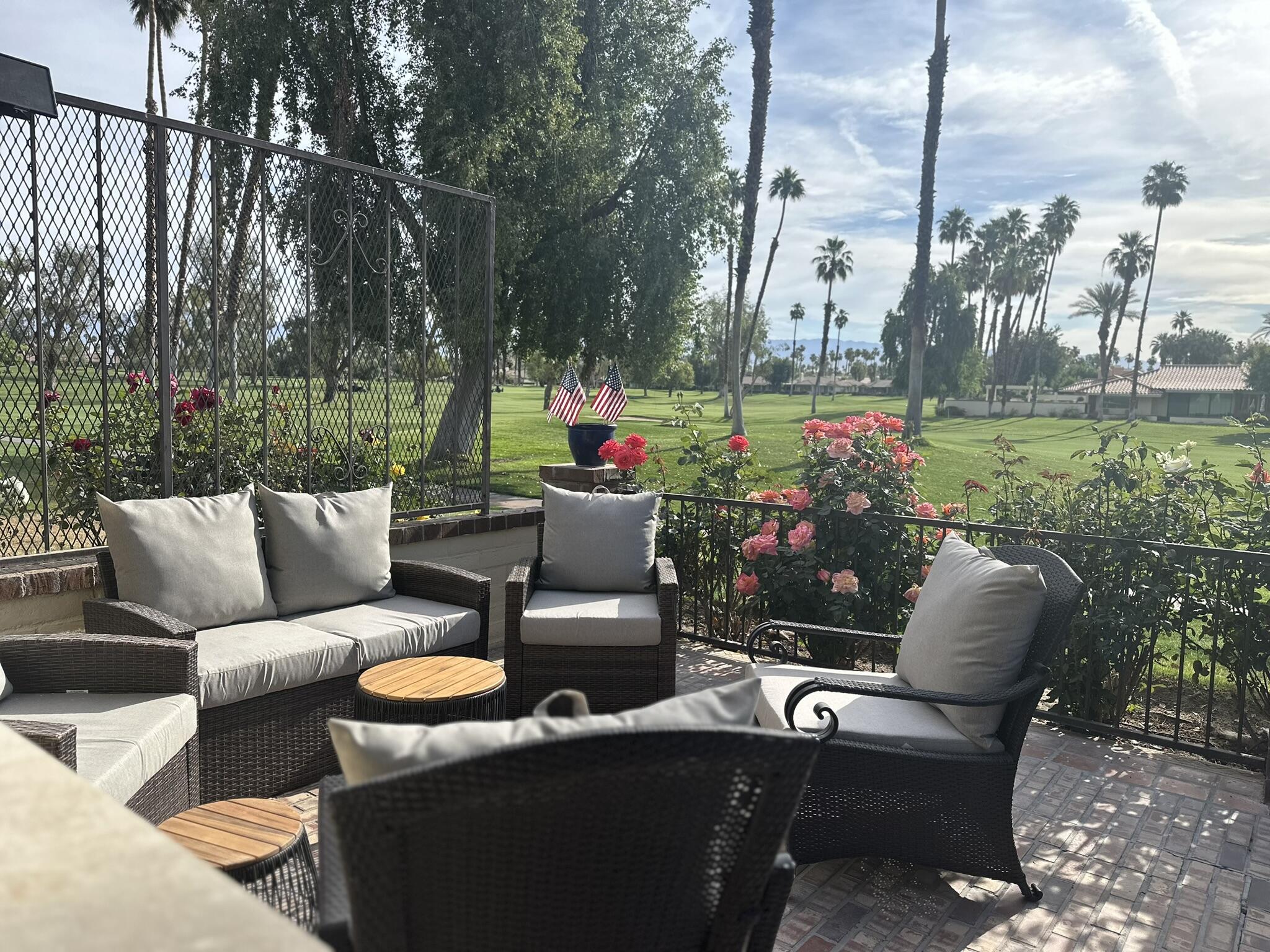 a outdoor living space with furniture and garden view