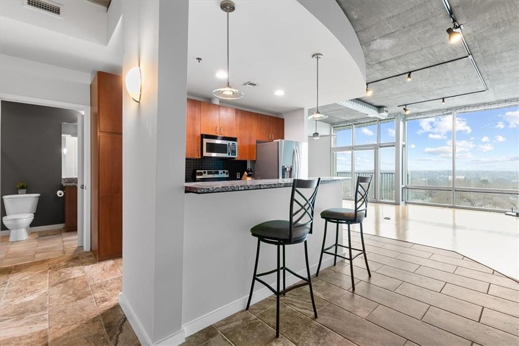 a view of a kitchen and dining room