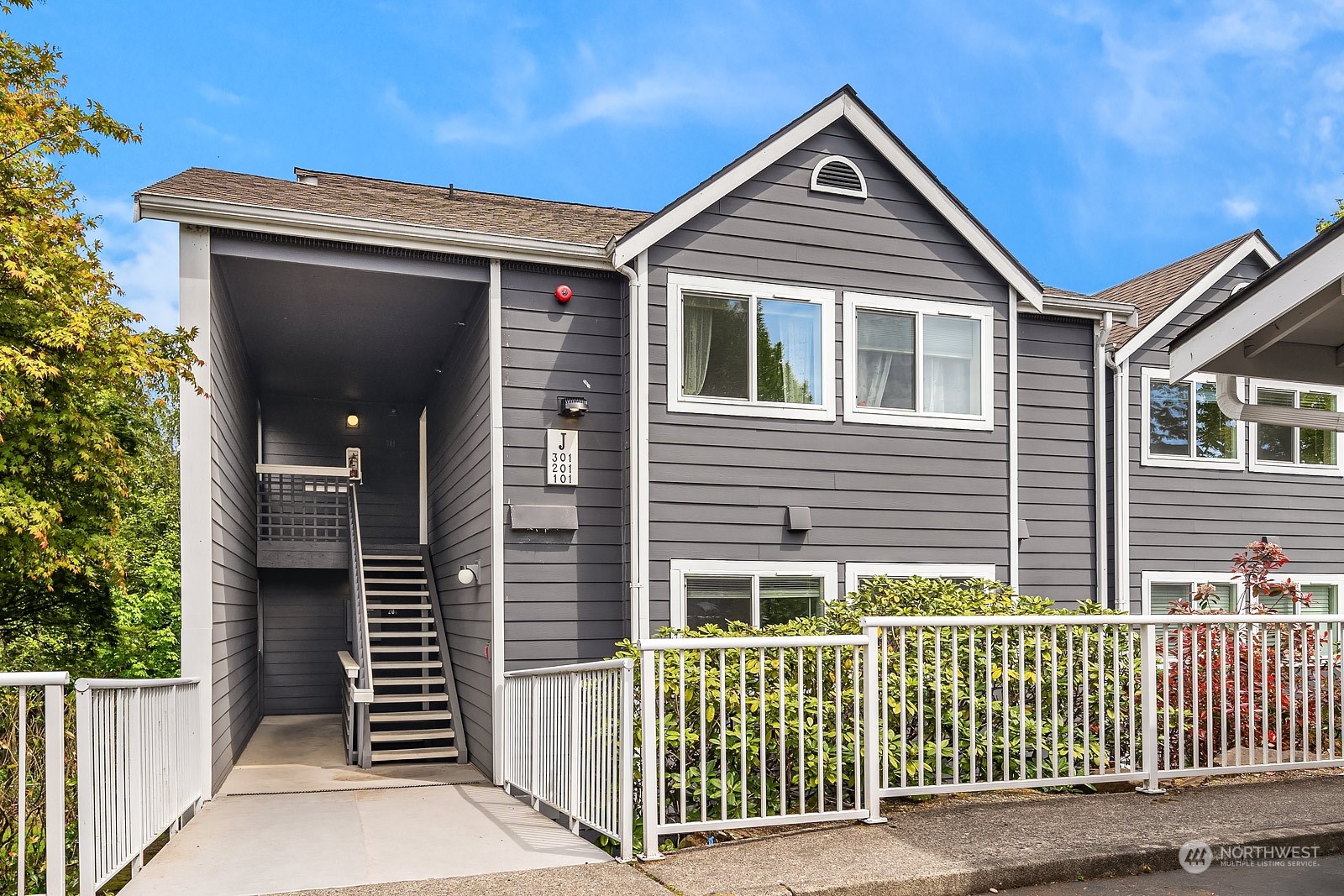 a front view of a house with garage