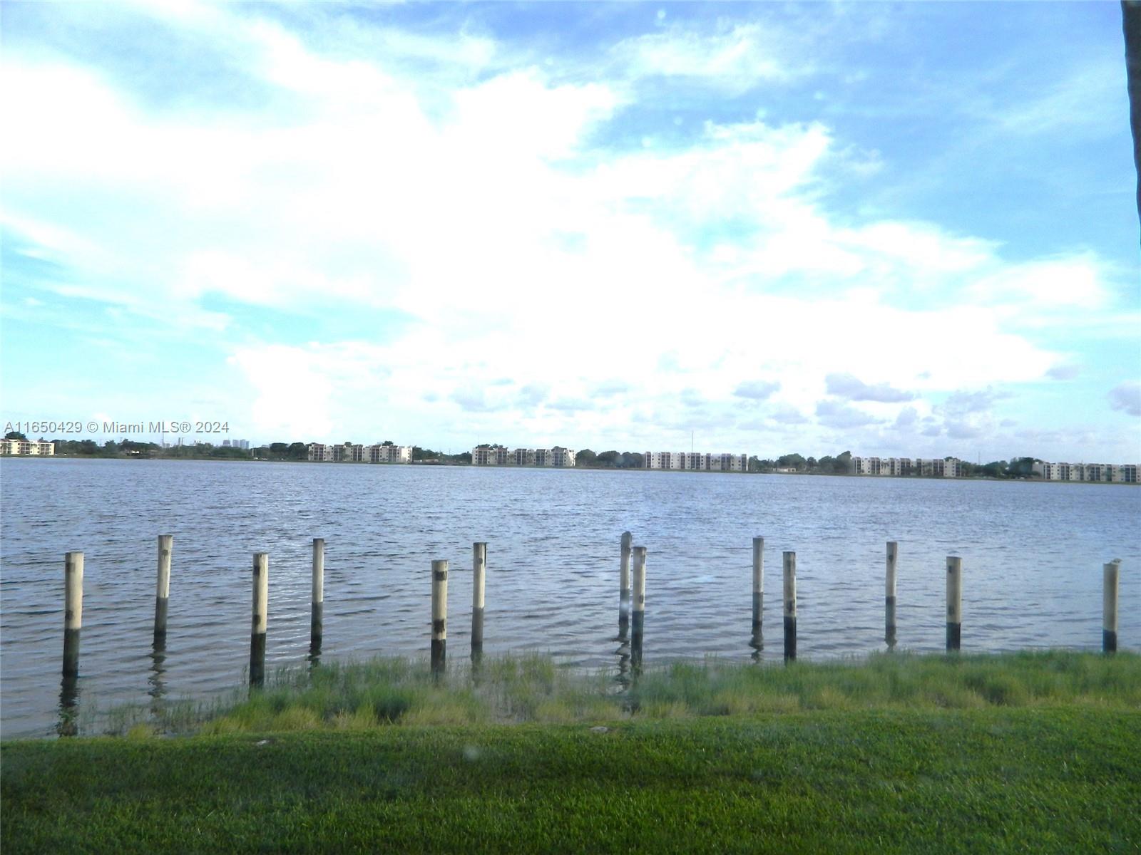 a view of a lake with a yard