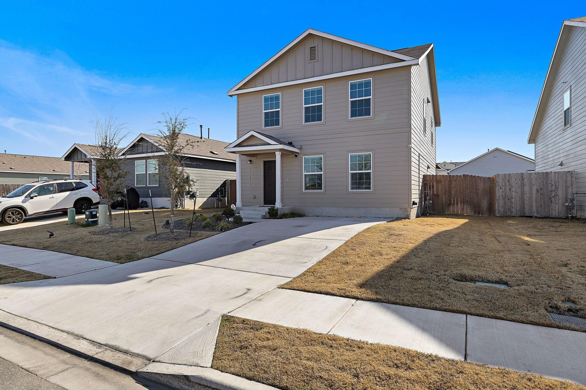 a front view of a house with a yard