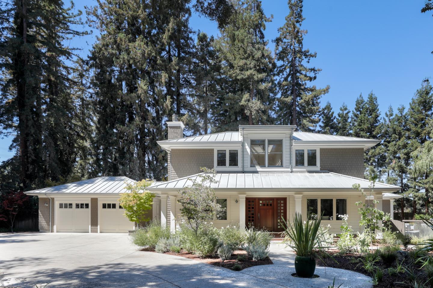 a front view of a house with garden