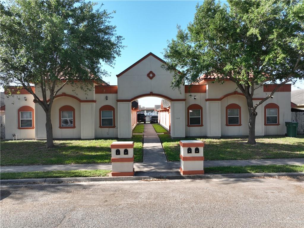 a front view of a house with garden