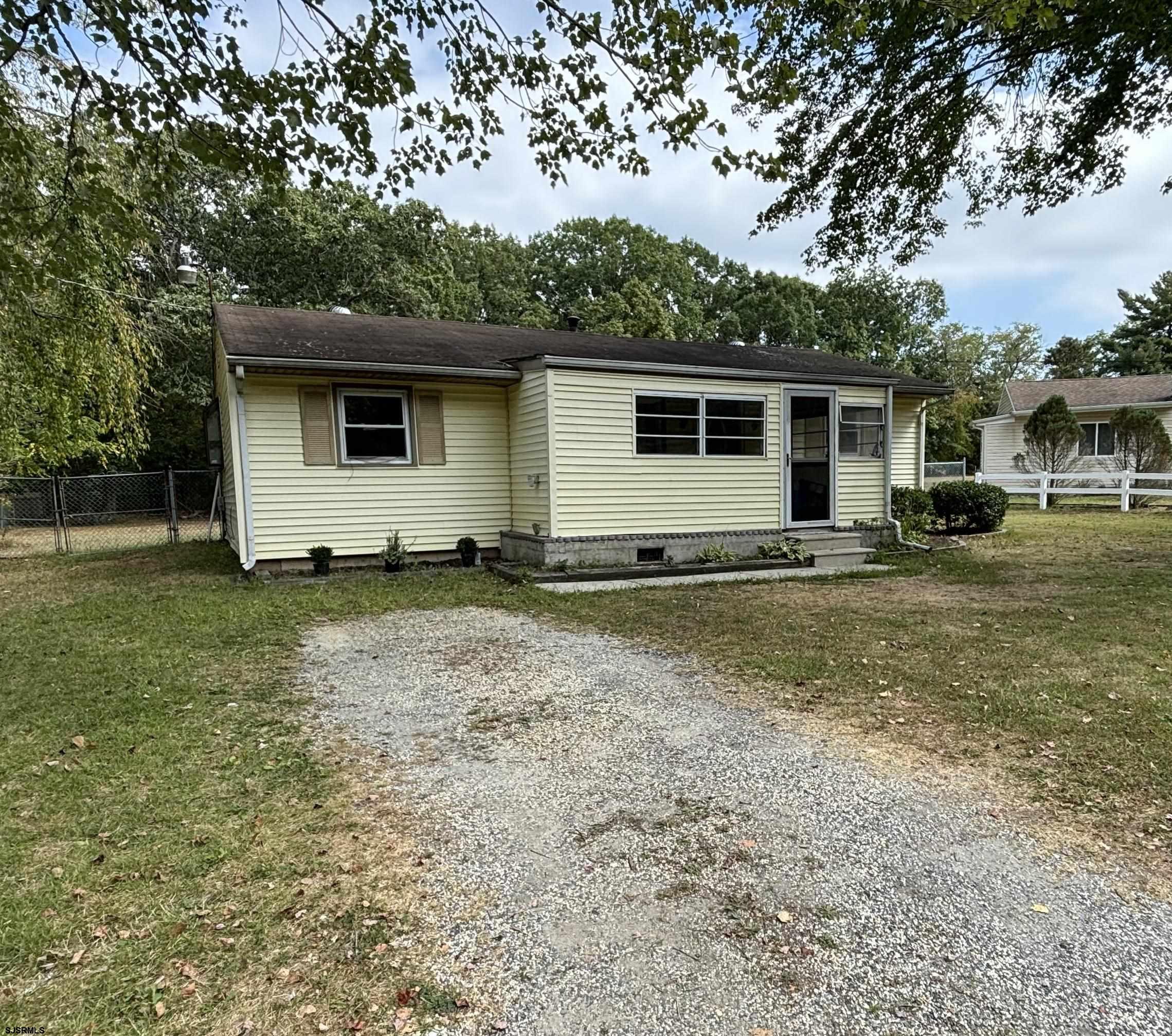 a view of a house with a yard